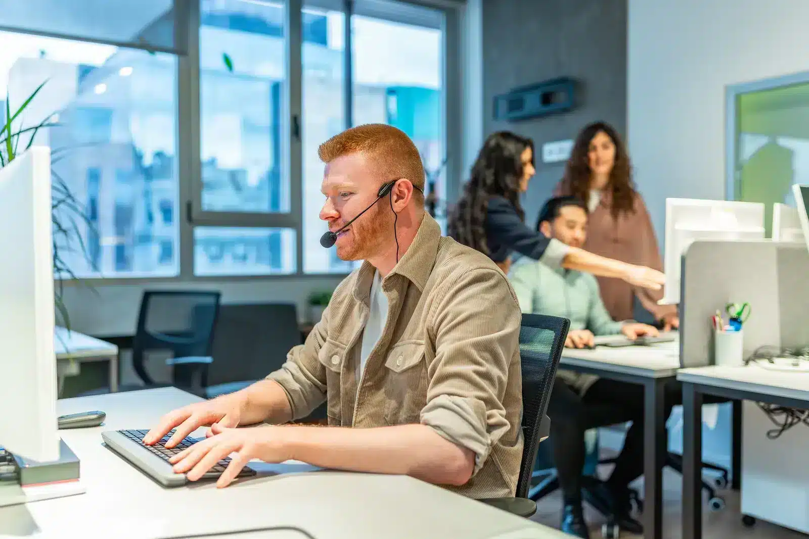 operator-with-headset-typing-on-keyboard-in-busy-o-2025-07-14-00-22-10-utc healthcare-bpo-support-services-2