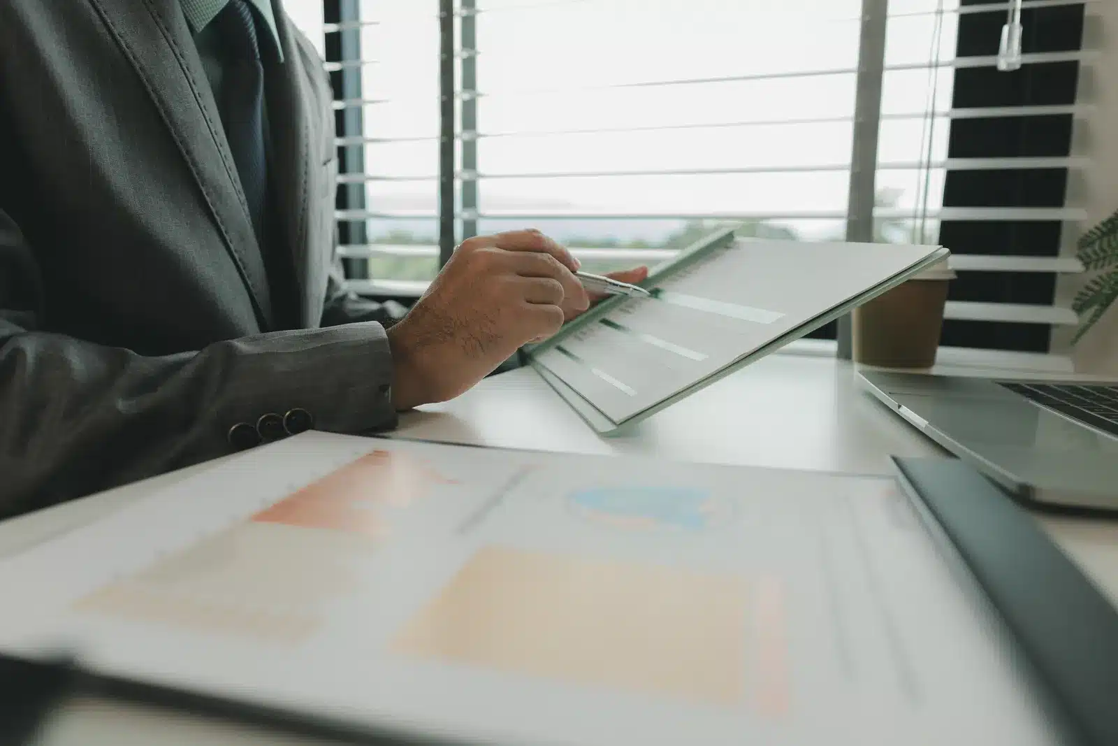 HR professional reviewing healthcare cost containment data for specialty drug claims