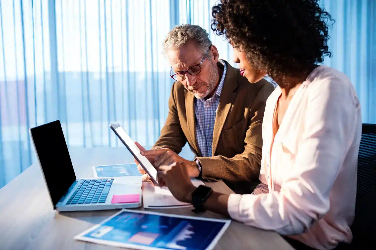 coworkers-analyzing-benefits-administration-technology